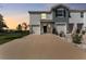 New construction townhome featuring a two-car garage, and neutral colored exteriors at 308 Mangrove Shade Cir, Apollo Beach, FL 33572