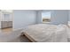 A well-lit main bedroom provides a bathroom and large window at 308 Mangrove Shade Cir, Apollo Beach, FL 33572