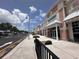 Exterior view of shops showcasing the street level view with pedestrian access and ample parking in the retail center at 308 Mangrove Shade Cir, Apollo Beach, FL 33572