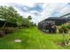 Large, well-maintained backyard with screened patio offers privacy and space for outdoor activities at 3144 Mountain Spruce Ter, Wesley Chapel, FL 33543