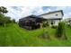 Lush green backyard with a screened patio that provides a secluded outdoor living area at 3144 Mountain Spruce Ter, Wesley Chapel, FL 33543