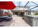 Spacious backyard patio features a brick floor, hot tub, and outdoor bar area for entertaining at 3144 Mountain Spruce Ter, Wesley Chapel, FL 33543