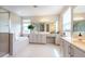 A bright bathroom with double vanity sinks, a soaking tub, and a glass-enclosed shower at 3144 Mountain Spruce Ter, Wesley Chapel, FL 33543