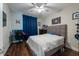 Teen bedroom with hardwood floors, a desk, a queen-size bed, and neutral decor at 3144 Mountain Spruce Ter, Wesley Chapel, FL 33543