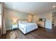 This bedroom features recessed lighting, wood floors, and a comfortable queen size bed at 3144 Mountain Spruce Ter, Wesley Chapel, FL 33543