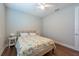 Bedroom with wood floors, neutral decor, fan and natural light at 3144 Mountain Spruce Ter, Wesley Chapel, FL 33543