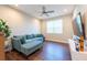 Cozy bonus room with comfortable seating, ceiling fan and a TV at 3144 Mountain Spruce Ter, Wesley Chapel, FL 33543