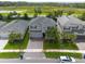 Beautiful two-story home with a well-maintained lawn and brick driveway at 3144 Mountain Spruce Ter, Wesley Chapel, FL 33543