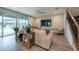 Comfortable living room with large TV and staircase at 3144 Mountain Spruce Ter, Wesley Chapel, FL 33543