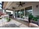 Covered patio with a built-in grill and outdoor seating, perfect for entertaining at 3144 Mountain Spruce Ter, Wesley Chapel, FL 33543