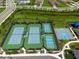 Aerial view of pristine tennis and basketball courts, providing residents with an active lifestyle at 3144 Mountain Spruce Ter, Wesley Chapel, FL 33543