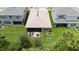 Aerial shot of the property showing the backyard, screened in patio, and surrounding neighborhood at 3318 Woodland Brook Way, Wesley Chapel, FL 33543