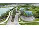 Scenic entrance to the community with lush landscaping, water features, and a guard house at 3318 Woodland Brook Way, Wesley Chapel, FL 33543
