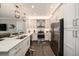 Kitchen featuring stainless steel appliances, an island, and pendant lighting at 3318 Woodland Brook Way, Wesley Chapel, FL 33543