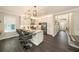 Modern kitchen featuring white cabinets, stainless steel appliances, and a center island with bar seating at 3318 Woodland Brook Way, Wesley Chapel, FL 33543