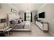 Beautiful main bedroom with a decorative chandelier and spacious furniture layout at 3318 Woodland Brook Way, Wesley Chapel, FL 33543