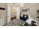 Comfortable office space featuring a modern desk setup and a view into the laundry room at 3318 Woodland Brook Way, Wesley Chapel, FL 33543