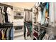 Well-organized walk-in closet with shelves, drawers, and ample space for clothes and accessories at 3318 Woodland Brook Way, Wesley Chapel, FL 33543
