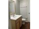Bathroom with standard vanity, toilet, and wood-look flooring at 337 S Mcmullen Booth Rd # 157, Clearwater, FL 33759