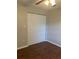 Bedroom with closet featuring standard doors and wood-look flooring at 337 S Mcmullen Booth Rd # 157, Clearwater, FL 33759