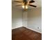 This bedroom features beautiful wood floors and a modern ceiling fan with light fixture at 337 S Mcmullen Booth Rd # 157, Clearwater, FL 33759