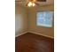 Cozy bedroom featuring a ceiling fan and wood-look flooring at 337 S Mcmullen Booth Rd # 157, Clearwater, FL 33759