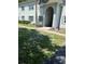 Two-story building with light blue exterior paint, blue shutters, and well-maintained landscaping in a sunny, inviting neighborhood at 337 S Mcmullen Booth Rd # 157, Clearwater, FL 33759