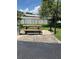 Community grilling area with picnic table and charcoal grill for outdoor gatherings at 337 S Mcmullen Booth Rd # 157, Clearwater, FL 33759