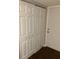 Hallway closet with standard doors and dark wood-look flooring at 337 S Mcmullen Booth Rd # 157, Clearwater, FL 33759