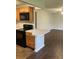 Kitchen featuring wood cabinets, black appliances, and an island with countertop, perfect for cooking and entertaining at 337 S Mcmullen Booth Rd # 157, Clearwater, FL 33759