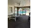 Indoor recreation area with ping pong table and view of the outdoor pool at 337 S Mcmullen Booth Rd # 157, Clearwater, FL 33759