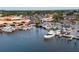 Stunning aerial view of the marina showcasing boats and the surrounding waterfront commercial area at 346 Gray Oak Dr, Tarpon Springs, FL 34689