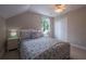 Cozy bedroom with ceiling fan, closet and bright window at 346 Gray Oak Dr, Tarpon Springs, FL 34689