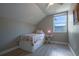 Light and airy bedroom features a cozy bed, window, and light wood floors at 346 Gray Oak Dr, Tarpon Springs, FL 34689