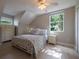 Bright bedroom with a bed, dresser, and windows that let in natural light, creating a welcoming space at 346 Gray Oak Dr, Tarpon Springs, FL 34689