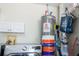 Laundry area with appliances and storage, offering convenience at 346 Gray Oak Dr, Tarpon Springs, FL 34689