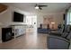 Comfortable living room featuring hardwood floors, modern furnishings, and a seamless view into the dining area at 346 Gray Oak Dr, Tarpon Springs, FL 34689