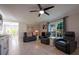 Inviting living room with large windows, sleek floors, and contemporary furnishings at 346 Gray Oak Dr, Tarpon Springs, FL 34689