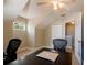 Comfortable office space with a ceiling fan, window, and desk with chair, great for remote work at 346 Gray Oak Dr, Tarpon Springs, FL 34689