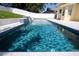 Inviting backyard pool with pristine white tile surrounds at 346 Gray Oak Dr, Tarpon Springs, FL 34689