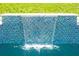 Beautiful mosaic tile waterfall feature enhancing the pool's appeal at 346 Gray Oak Dr, Tarpon Springs, FL 34689