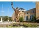 Statue in front of a church with detailed architecture and landscaping at 346 Gray Oak Dr, Tarpon Springs, FL 34689