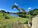 The backyard includes a pond and a few ornamental trees at 3501 Pine Top Dr, Valrico, FL 33594