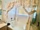 Bathtub and shower featuring decorative curtains with a palm tree design at 3501 Pine Top Dr, Valrico, FL 33594
