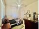 This bedroom includes tile floors, a ceiling fan, closet and simple decor at 3501 Pine Top Dr, Valrico, FL 33594