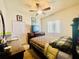 Cozy bedroom with ceiling fan, dresser and bed with decorative bedding at 3501 Pine Top Dr, Valrico, FL 33594
