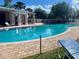 Soak up the sun at the community pool with comfortable lounge chairs, lush landscaping, and a refreshing atmosphere at 3501 Pine Top Dr, Valrico, FL 33594