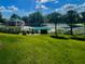 Enjoy this community pool surrounded by lush green grass and palm trees, perfect for relaxing on a sunny day at 3501 Pine Top Dr, Valrico, FL 33594