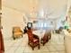 The dining room includes seating for six and is open to the living room at 3501 Pine Top Dr, Valrico, FL 33594