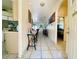 Hallway view with tiled floors that leads to the living room and a bedroom at 3501 Pine Top Dr, Valrico, FL 33594
